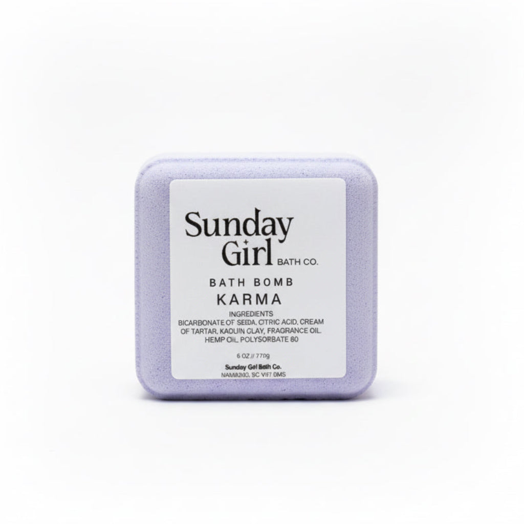 Sunday Girl bath bomb labeled 'Karma' on a white background