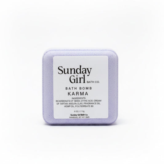 Sunday Girl bath bomb labeled 'Karma' on a white background