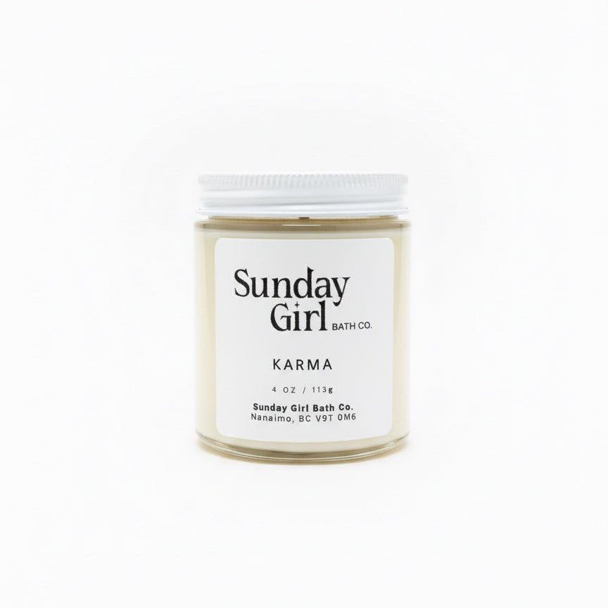 Candle jar labeled 'Sunday Girl' on a white background