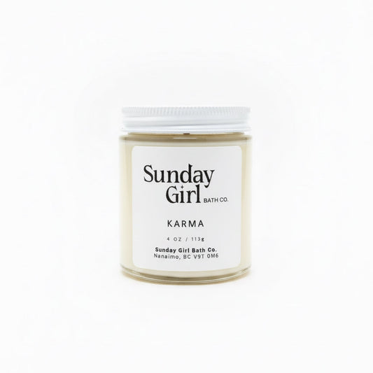 Candle jar labeled 'Sunday Girl' on a white background